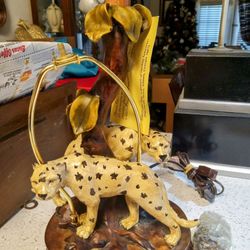 AI Overview



This is a lamp featuring a sculpture from the De Capoli Lover Leopard Collection, crafted by Platimi Kitan of Sterling Industries. T