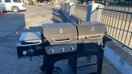 Member's Mark Charcoal & Gas Combo Grill with Sideburner, a dual-fuel outdoor hybrid barbecue.
