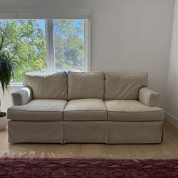 A Set Of Two Sofas