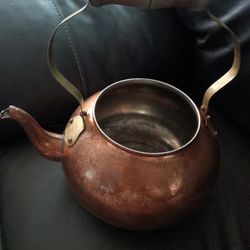 Antique copper kettle. Copper kettle with wooden handle 