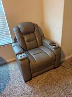 Electric sofa set with cup holders and charging station.