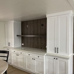 Floating Shelve And White Shakers Cabinets