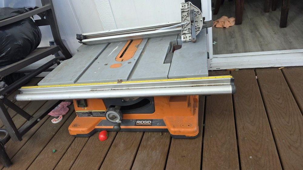 RIDGID 10-inch table saw with a folding stand. It is a portable, corded jobsite table saw.