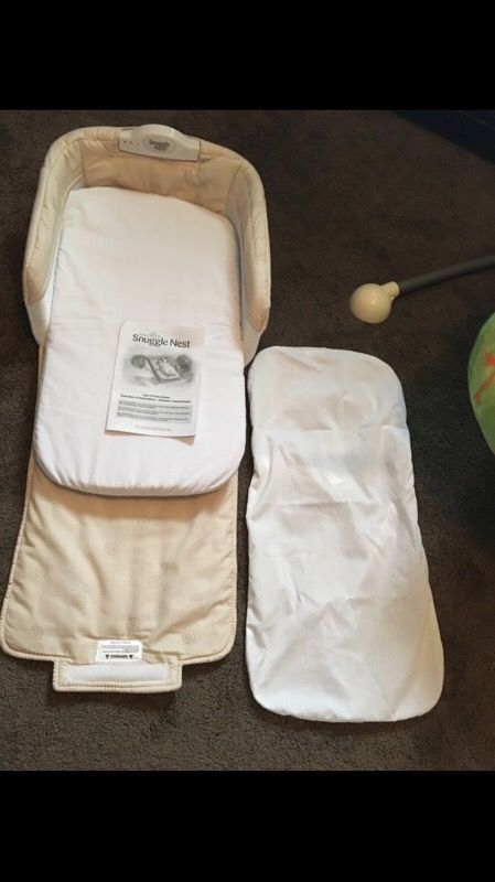 NEW Snuggle Nest Co-Sleeper with Extra Sheets. Has nightlight and plays music. Battery included. Portable