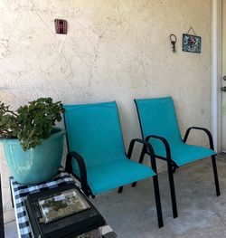 2 Teal Patio Chairs