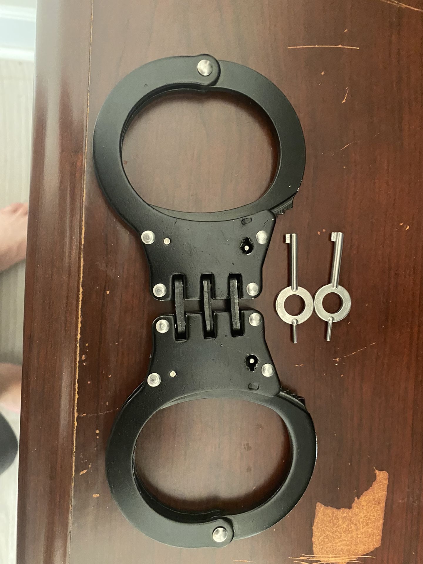Police handcuffs come with two keys