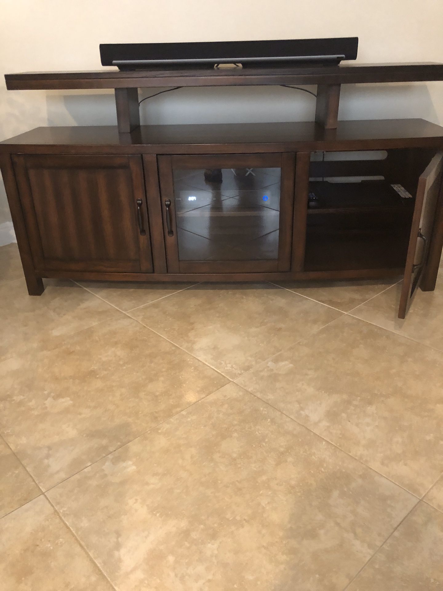 Entertainment Console made by Weston. It is 60”, in great condition. The Sonar Bar is not included.