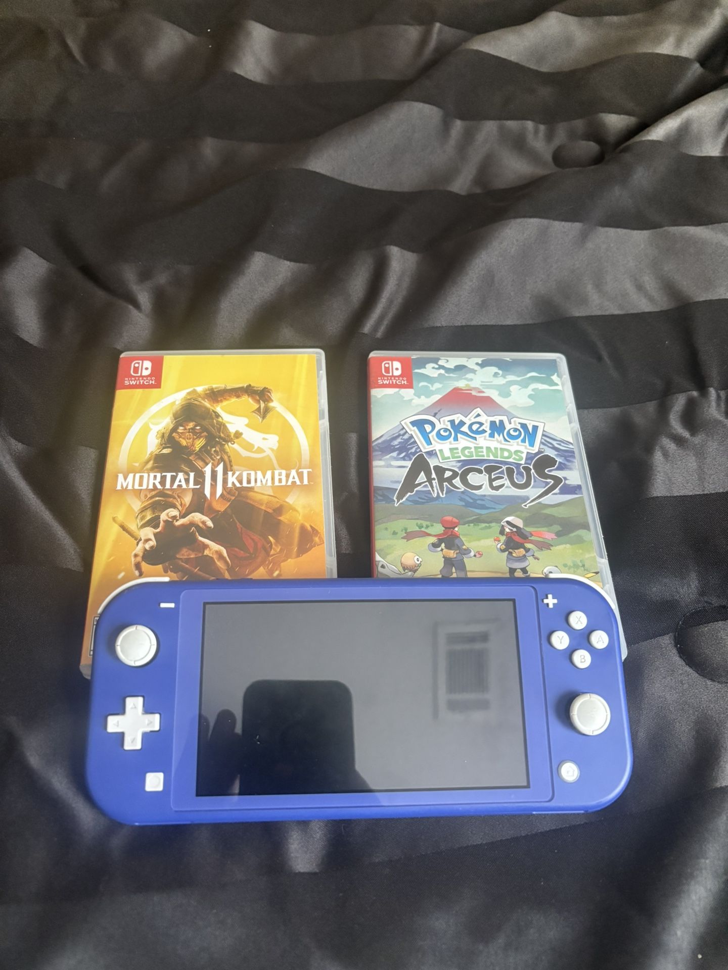 Nintendo Switch Lite – Blue (w/ Charger + 2 Games)