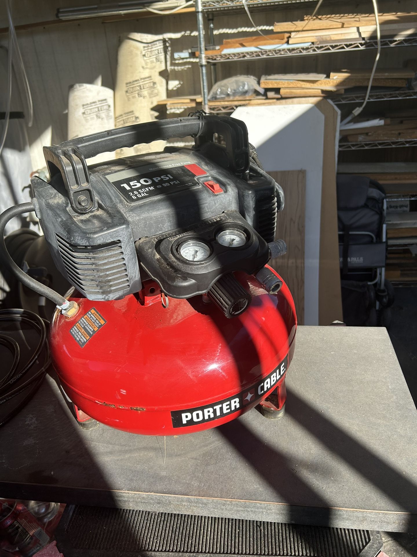 Porter Cable 150 PSI Pancake Compressor And 2 Porter Cable 18gage Brad Nailers And 1 Hitachi Brad Nailer.