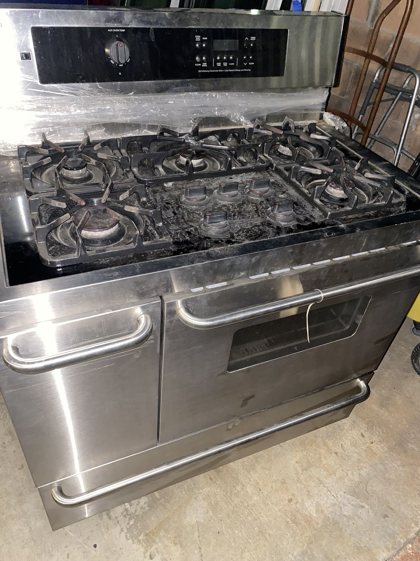 stainless steel industrial  6 burner stove  Brand Frigidaire  Works great.    
