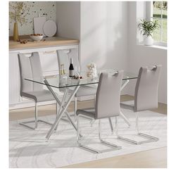 Glass Dining table with grey chairs