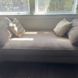 Brown Day Bed With Bedding