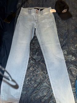 Light blue skinny jeans with elastic waist band and long for taller people