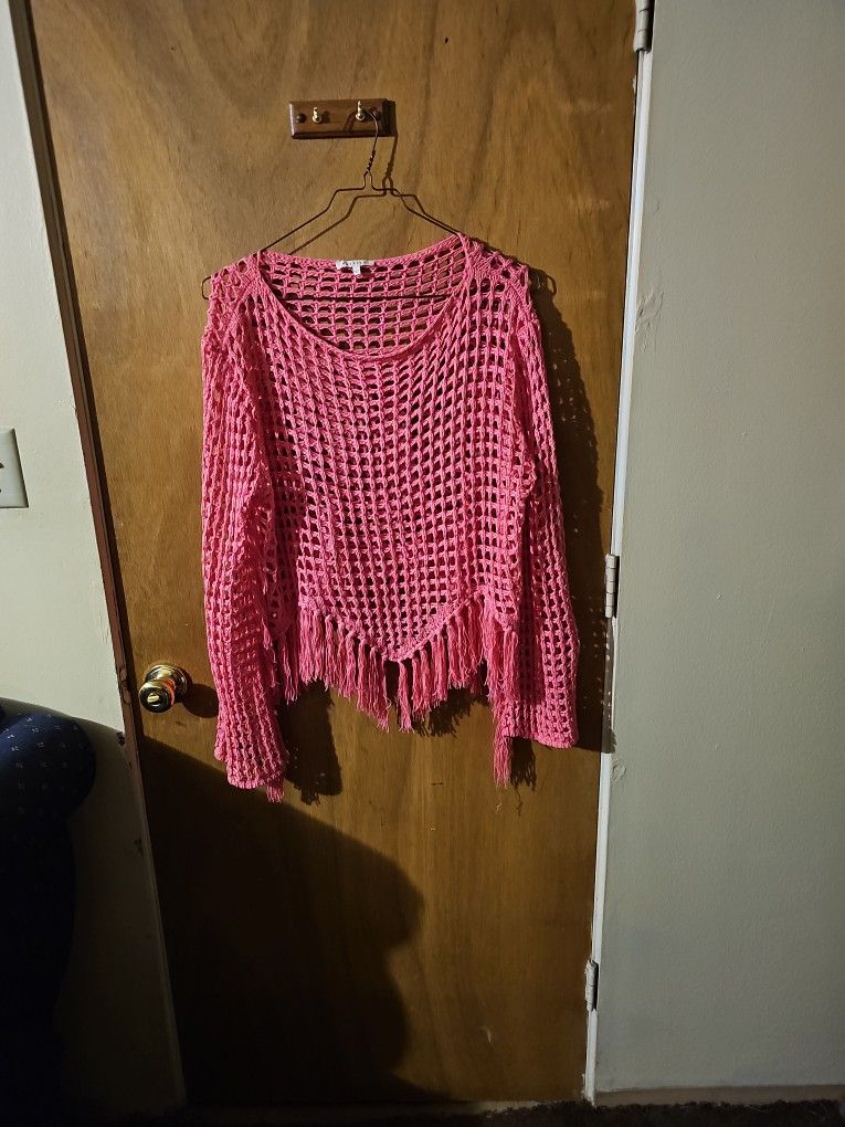 Stylish pink crochet sweater with fringe
