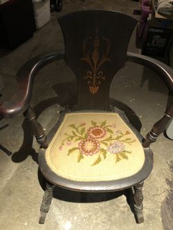 Two antique wooden chairs with needlepoint seats