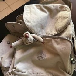 Stylish Coach crossbody bag has signature brown monogram canvas with yellow and black snakeskin leather detail. Bag features adjustable cream fabric s