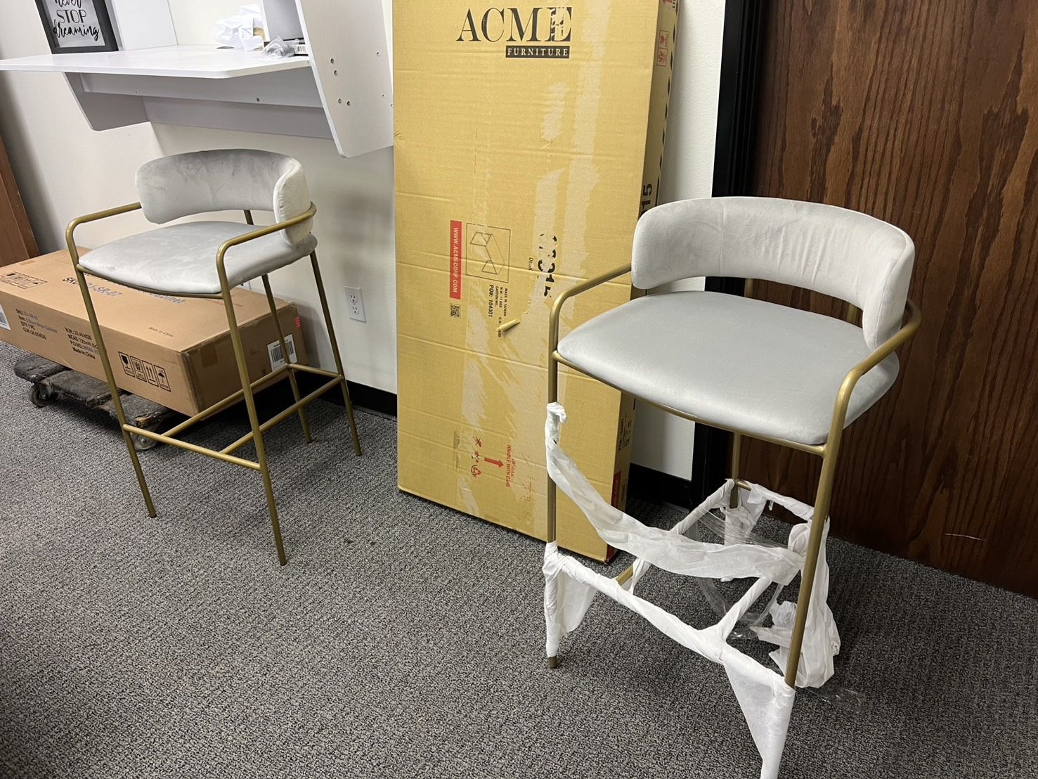 Set of two bar stools with gold frame and Light Gray seat.