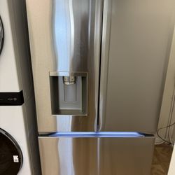LIKE NEW LG FRENCH DOOR STAINLESS STEEL REFRIGERATOR. 