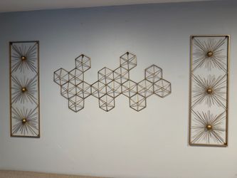 Gold Metal Wall decorations and tables