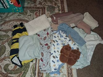 Brand new baby boy swaddles and clothes