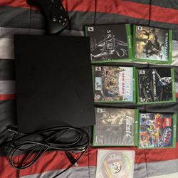 XBOX ONE X W/ controller , power cords and 7 Games !