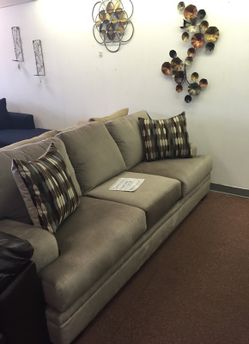 Grey Serta sofa and loveseat