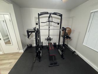 Marcy home gym power rack with pull-up bar and cable system.