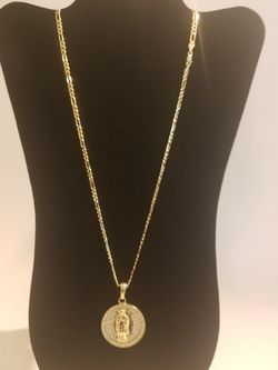 14k gold filled Figaro chain with mary pendant.