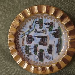 vintage Japanese porcelain souvenir wall plate with openwork design and gold finish, likely from the 1950s. 