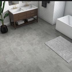 15 boxes 675 sqft -Nova Floor -luxury glue down vinyl. Color concrete Capone -36”x18” planks .