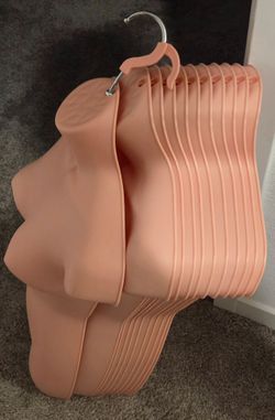 Flesh-toned plastic female hanging mannequin torsos x11