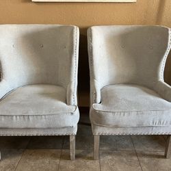 2 Light Grey Chairs .