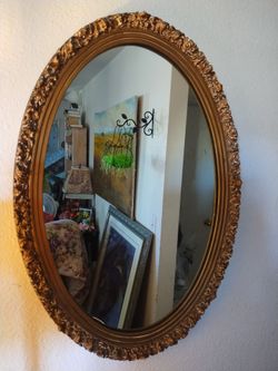 Large oval antique mirror
