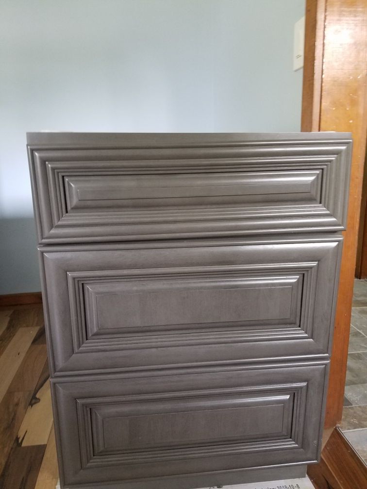 Brand new Grey Satin stain 3 drawer 24" kitchen cabinets. Two of them that were $500 new. Asking $400 each or best offer.