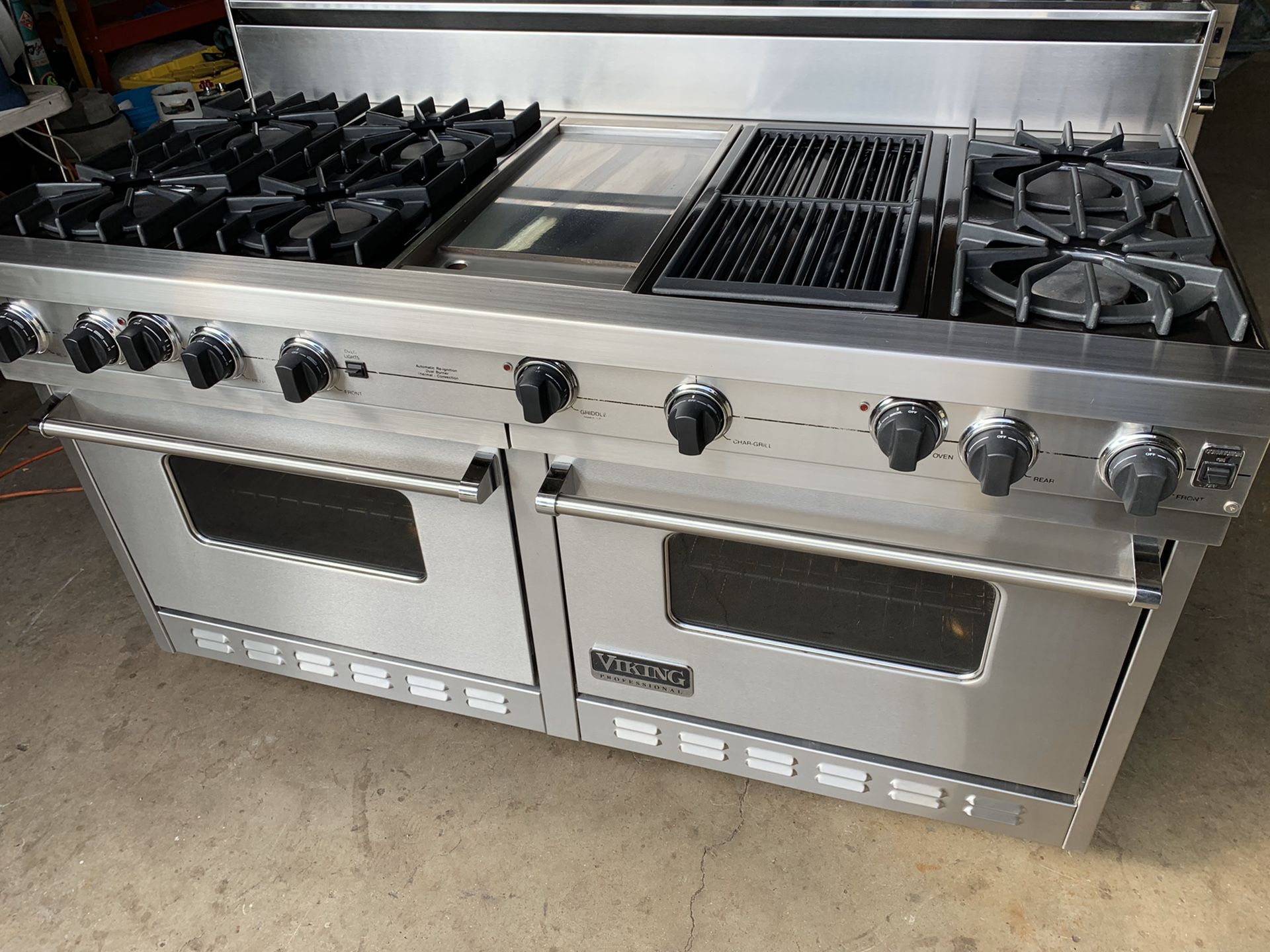 Viking 60” propane range with grill and griddle, 6 burners and two large ovens.
