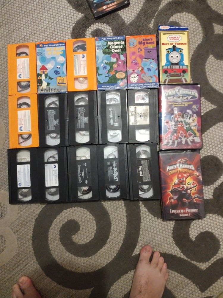 A Variety Of VHS Tapes And CDs