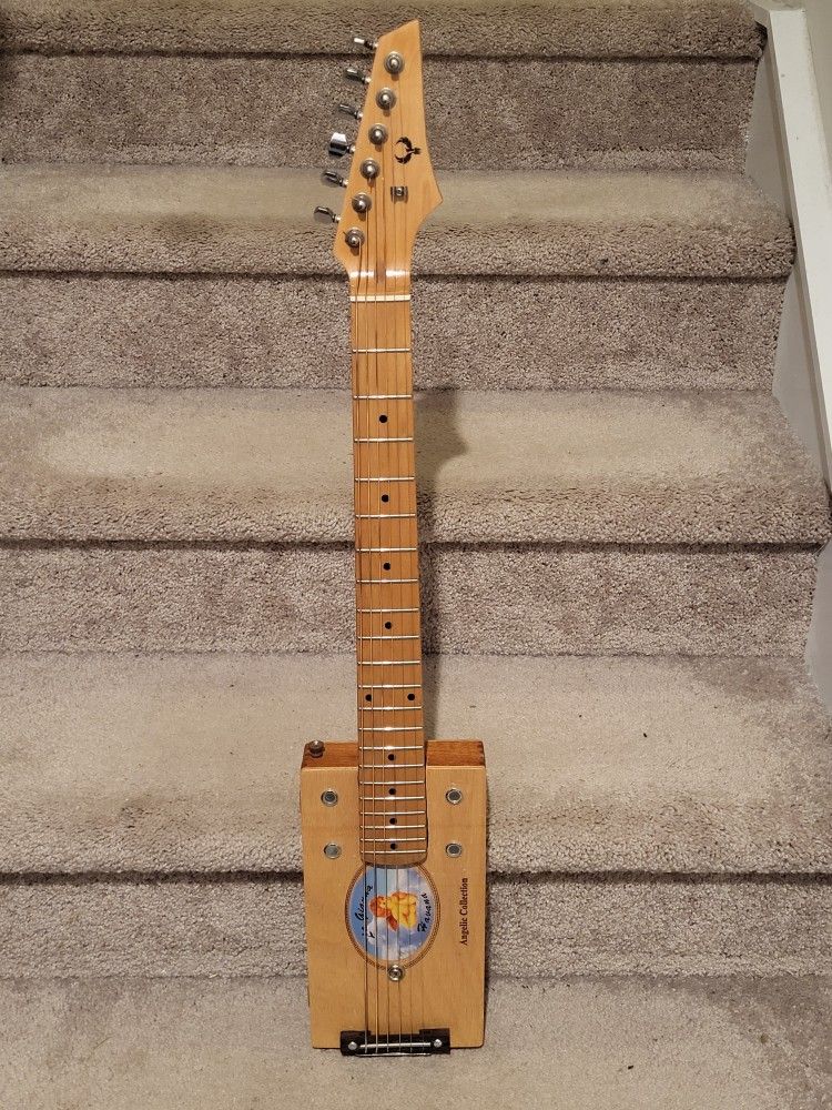 Not Your Father's Cigar Box Guitar- Old School Sound Meets Modern Playability