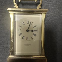 Carriage  clock by Searle & Co. Ltd
