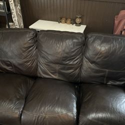 Brown leather reclining sofa couch