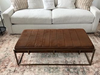 Ottoman with velvety cushion