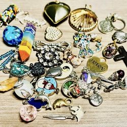 Vintage  Pendants and trinkets. These pendants and trinkets are small. As is. No returns. What you see is what you get. Make me an offer I can’t refus