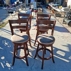 4 Brown Wooden Stools 