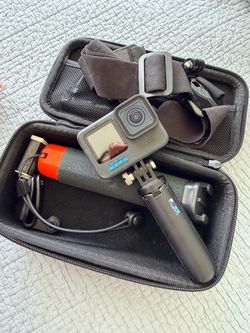 GoPro HERO9 Black Camera with Black and Orange Floating Handle and Mounts