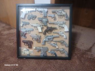 Vintage Toy Cap Guns In glass framed display.   Lot of (21)  Some Rare And Scarce A must have!!