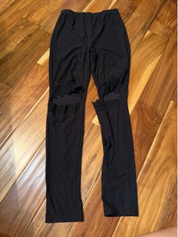 Women’s black cut out knee lace leggings. Size large