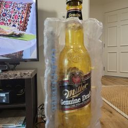 Display Of Giant Beer Bottle On Ice 