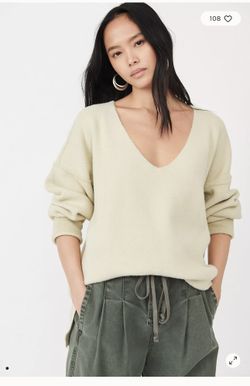 Free people Oversized women’s v-neck Sweater . Size: medium.  Gently Used Condition. 