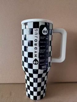 Hydrojug traveler 40 oz tumbler. Blk/beige checkered.Screw on lid flip straw