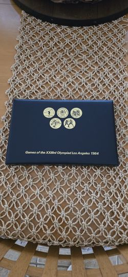 VINTAGE SET OF 24 COINS FROM THE GAMES OF THE XXIIIRD 1984 LA OLYMPICS 