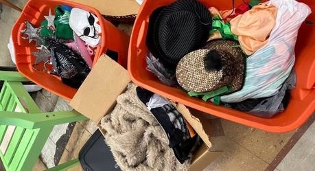 Assorted Halloween costumes with bins